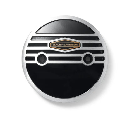 Silver circle alternator plug cover with black detailed and gold Harley-Davidson logo